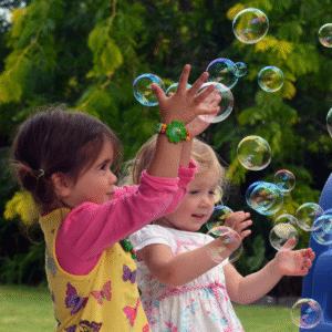 outdoor play, fresh air, preschoolers, preschool, happy, fun, bubbles, play