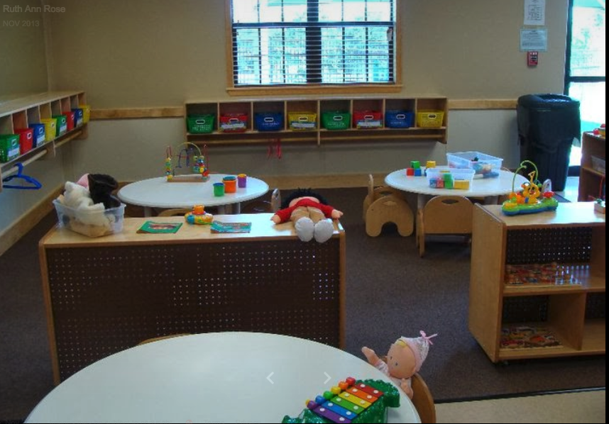 Our little 12 - 18 month olds love to explore and play in their bright classroom!