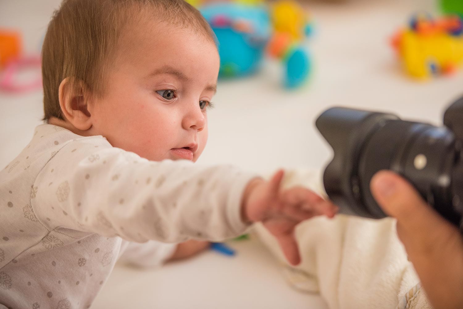 Camera in child care center taking photo of an infant