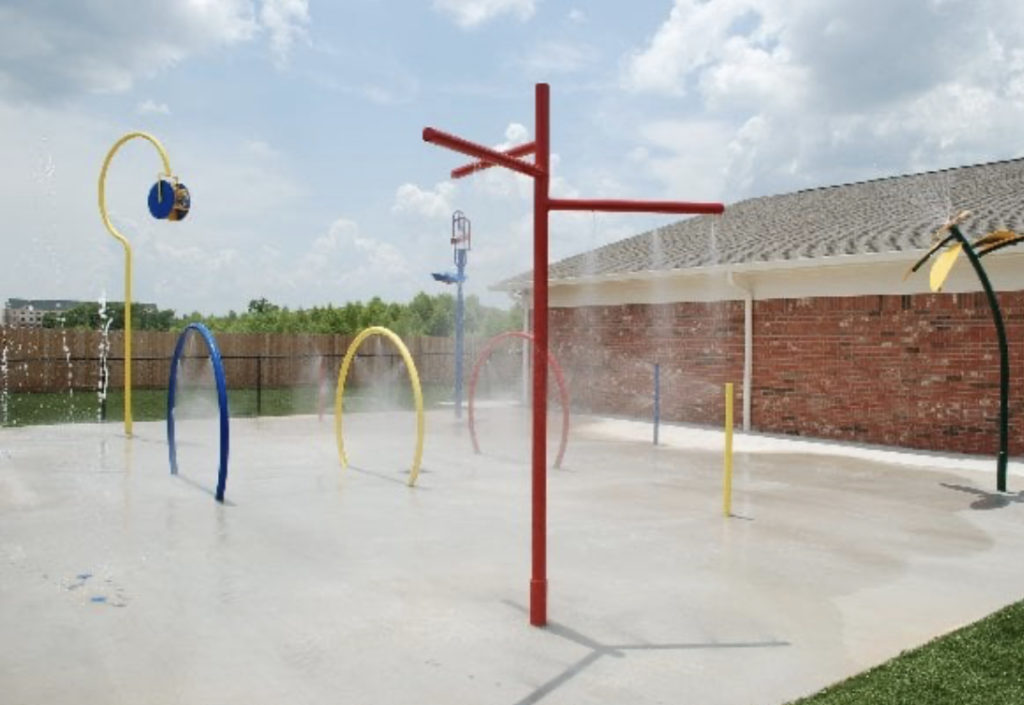 During summer months, kids enjoy our splash pad. This is a favorite among parents  as well.