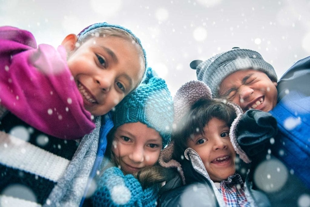 Preschool group bundled in coats for snow and cold weather
