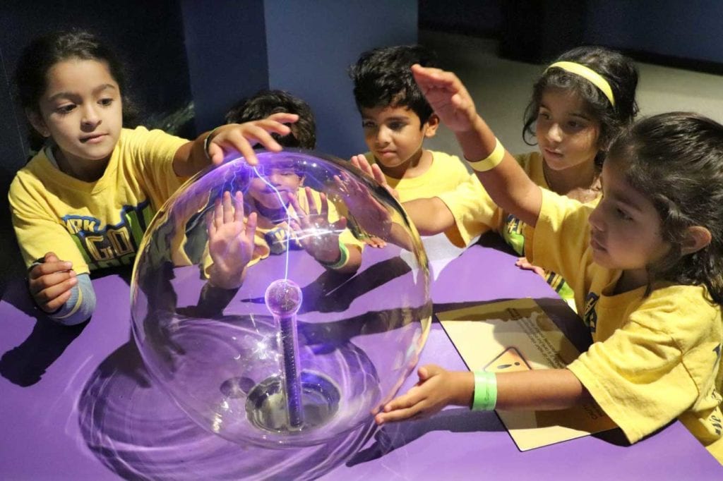 Summer camp kids learning science at the Museum